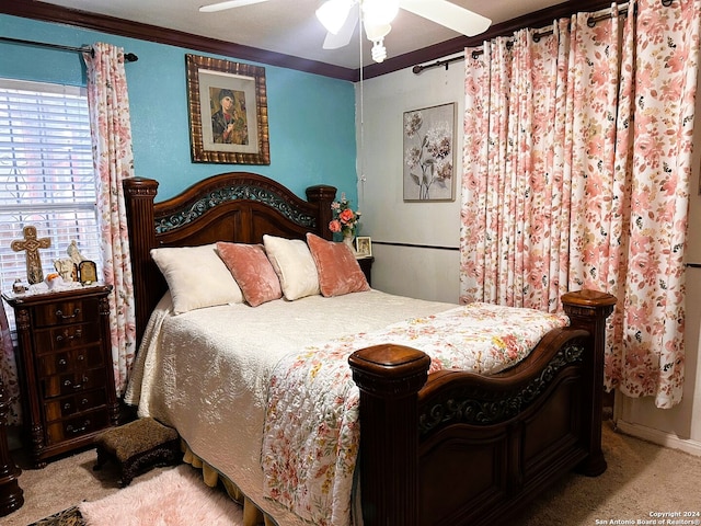 bedroom with crown molding, carpet flooring, and ceiling fan