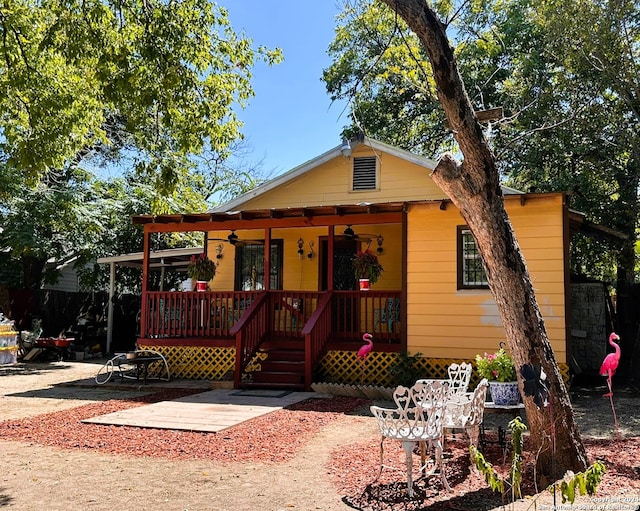 bungalow with covered porch and ceiling fan