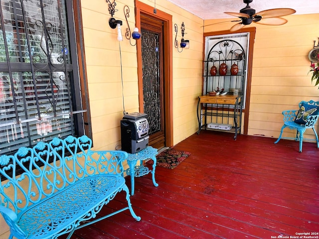 exterior space featuring a porch and ceiling fan