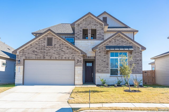 view of front of house featuring fence, a front lawn, an attached garage, and brick siding
