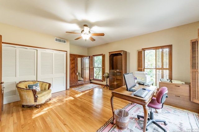 office area featuring light hardwood / wood-style floors and ceiling fan