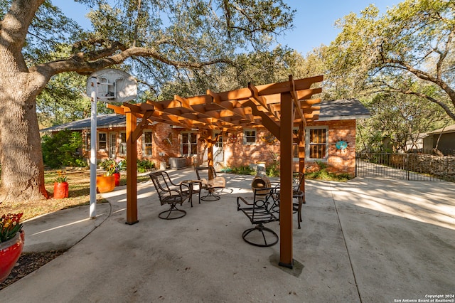 view of patio with central air condition unit and a pergola