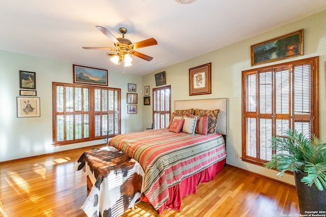 bedroom featuring light wood-type flooring and ceiling fan