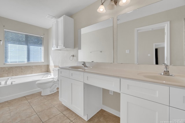 bathroom with vanity, a bath, toilet, and tile patterned floors