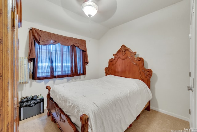 carpeted bedroom with lofted ceiling and ceiling fan