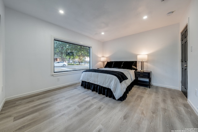 bedroom with light hardwood / wood-style floors