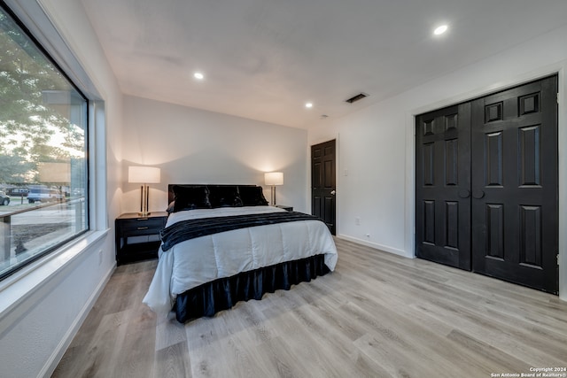 bedroom featuring a closet and light hardwood / wood-style flooring