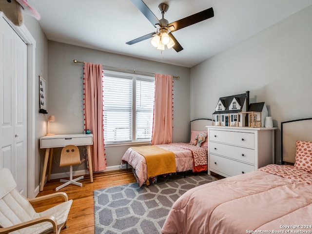 bedroom featuring a closet, ceiling fan, and hardwood / wood-style flooring