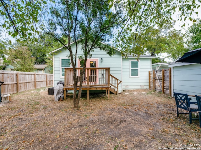 back of house featuring a deck