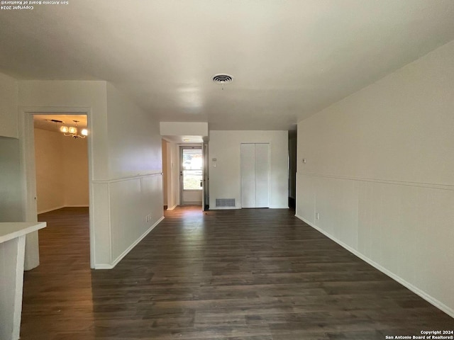 unfurnished room with dark hardwood / wood-style floors