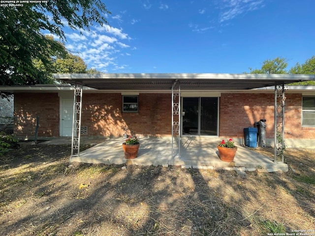 back of property featuring a patio