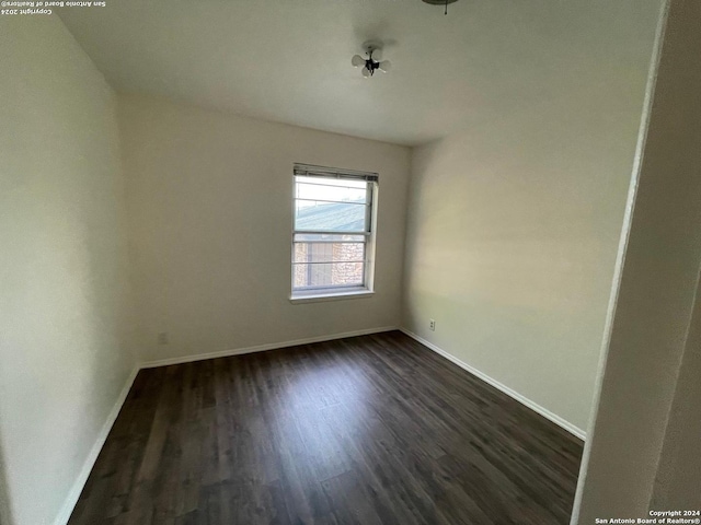 empty room featuring dark hardwood / wood-style floors