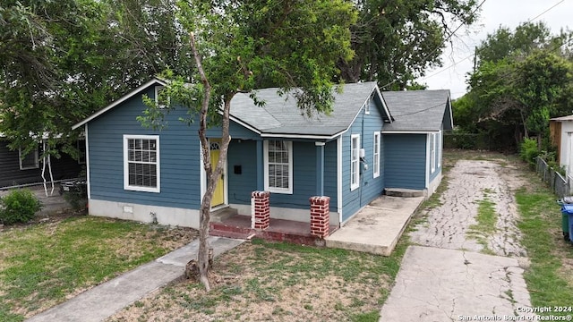 bungalow-style house featuring a front yard