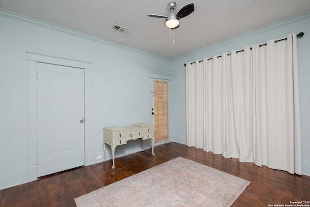 unfurnished bedroom featuring crown molding, ceiling fan, and dark hardwood / wood-style flooring