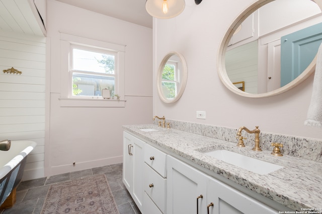 bathroom featuring vanity and a bathtub