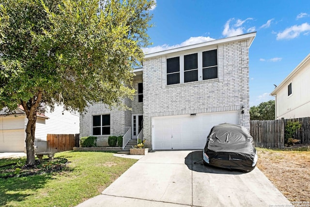 view of front property with a garage and a front lawn