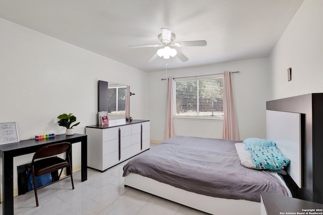 tiled bedroom featuring ceiling fan