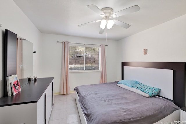 bedroom with light tile patterned floors and ceiling fan