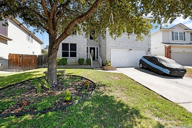 view of front facade featuring a front yard and a garage