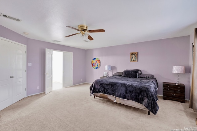 carpeted bedroom with ceiling fan