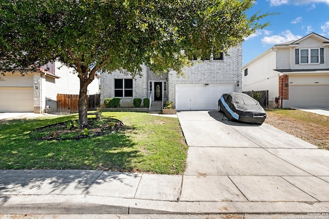 view of front of home featuring a garage and a front lawn