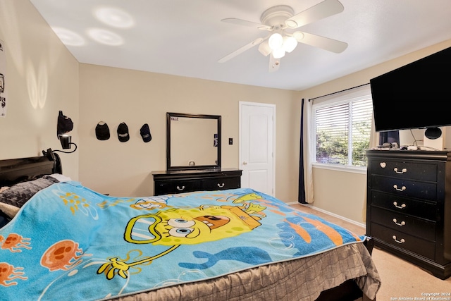 bedroom featuring light carpet and ceiling fan