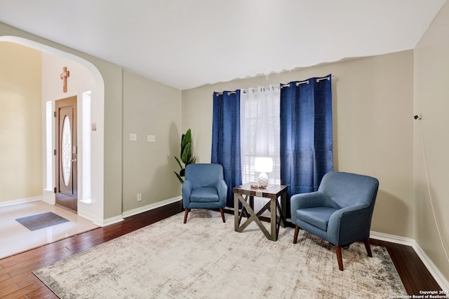 living area with hardwood / wood-style flooring