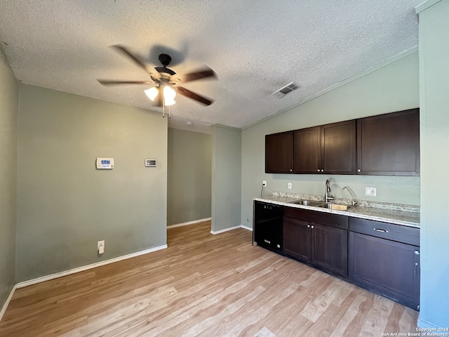 kitchen featuring black dishwasher, dark brown cabinets, a textured ceiling, light hardwood / wood-style flooring, and sink