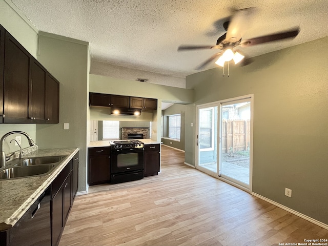 kitchen featuring light hardwood / wood-style flooring, dark brown cabinets, a textured ceiling, and electric range