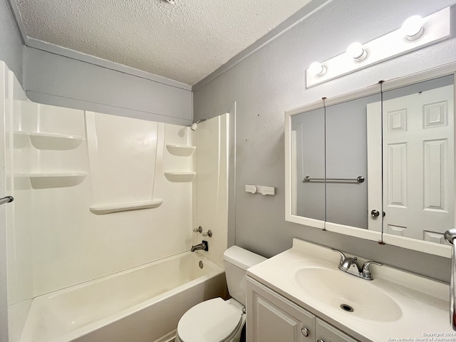 full bathroom featuring toilet, shower / bathing tub combination, a textured ceiling, and vanity