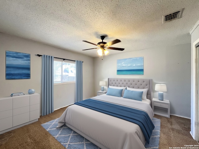 bedroom with carpet floors, a textured ceiling, and ceiling fan