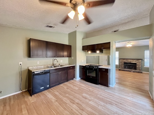 kitchen featuring black appliances, light hardwood / wood-style flooring, and dark brown cabinets