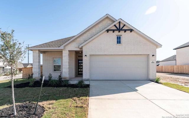 1806 Small Ship, San Antonio, TX 78245 - view of front of home with brick siding, driveway, roof with shingles, and an attached garage