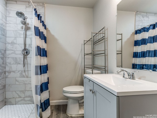 bathroom with vanity, hardwood / wood-style floors, curtained shower, and toilet