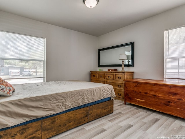 bedroom with light hardwood / wood-style floors