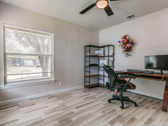 office space with light wood-type flooring and ceiling fan