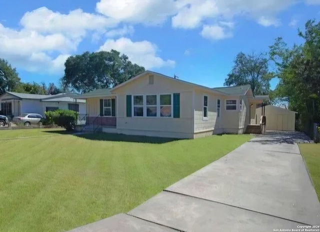 rear view of house with a lawn