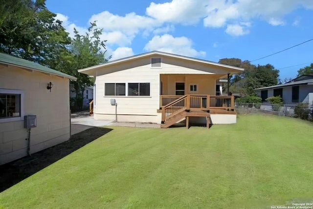 rear view of house with a lawn