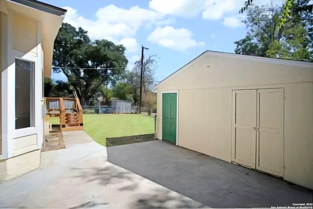 view of patio featuring a shed