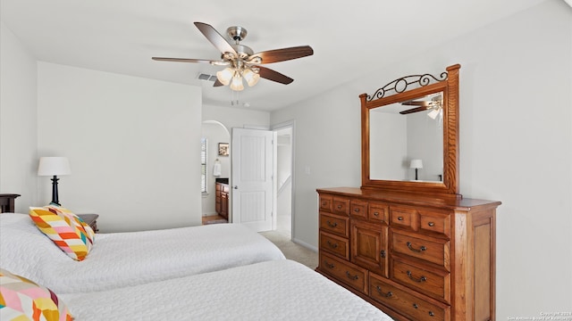 bedroom with ceiling fan and light colored carpet