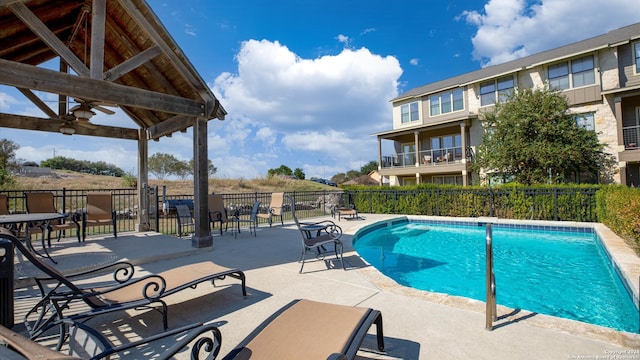 view of swimming pool with a gazebo and a patio area