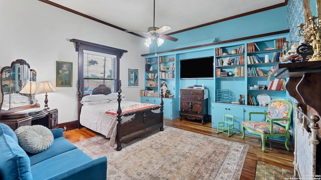 bedroom featuring ceiling fan, wood-type flooring, and ornamental molding