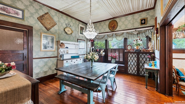 dining room with a healthy amount of sunlight, ornamental molding, and hardwood / wood-style floors