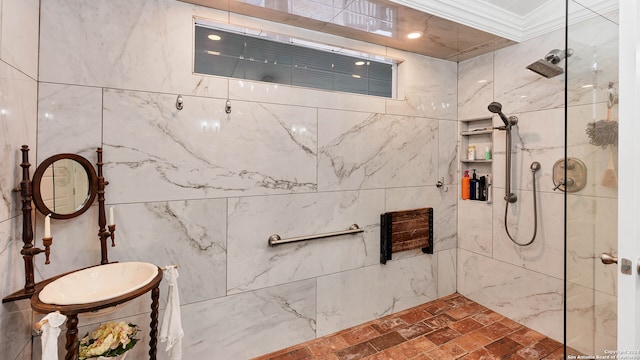 bathroom featuring ornamental molding and a tile shower