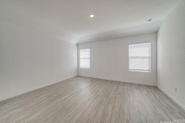 empty room featuring light hardwood / wood-style flooring and plenty of natural light