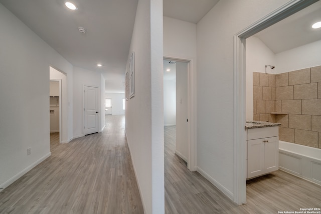 hall with light hardwood / wood-style flooring