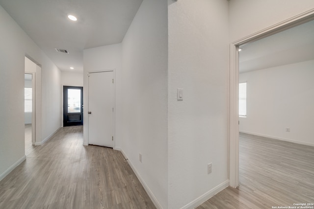 corridor featuring light wood-type flooring