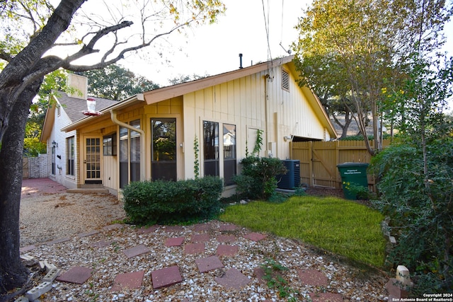 rear view of house featuring a patio area and central AC unit