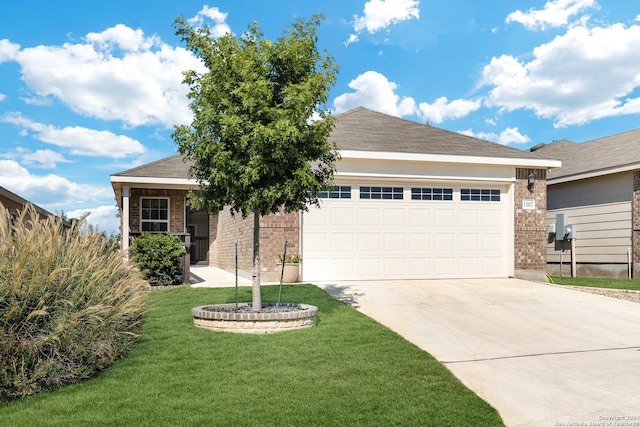 view of front facade with a front yard and a garage