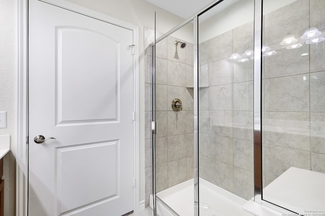 bathroom with vanity and an enclosed shower